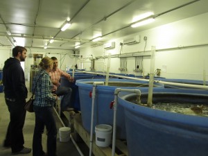 Marc Turano explains the aquaculture system to visitors. Photo by Andrew David Thaler