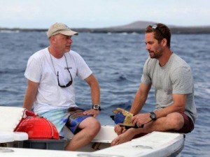 Paul Walker sits with Dr. Michael Domeier and some shark fishing gear. 