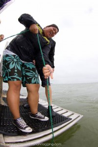 A participant helps us pull in a drumline, the fishing gear we use to catch sharks 